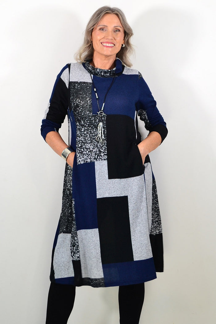 Long navy grey roll neck winter tunic by Hourglass Avalon, featuring a cozy fit and soft fabric, perfect for cold weather.
