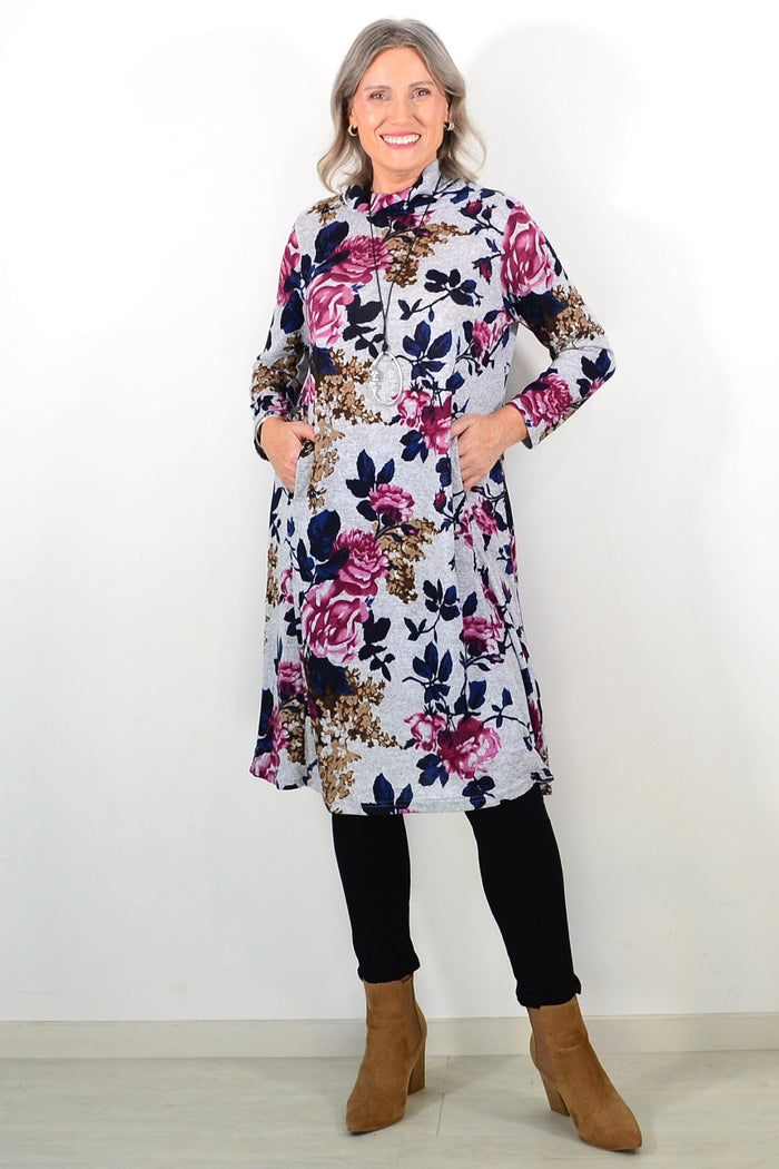 Long pink floral La Mode winter tunic with roll neck and long sleeves, featuring a flowy, feminine design.