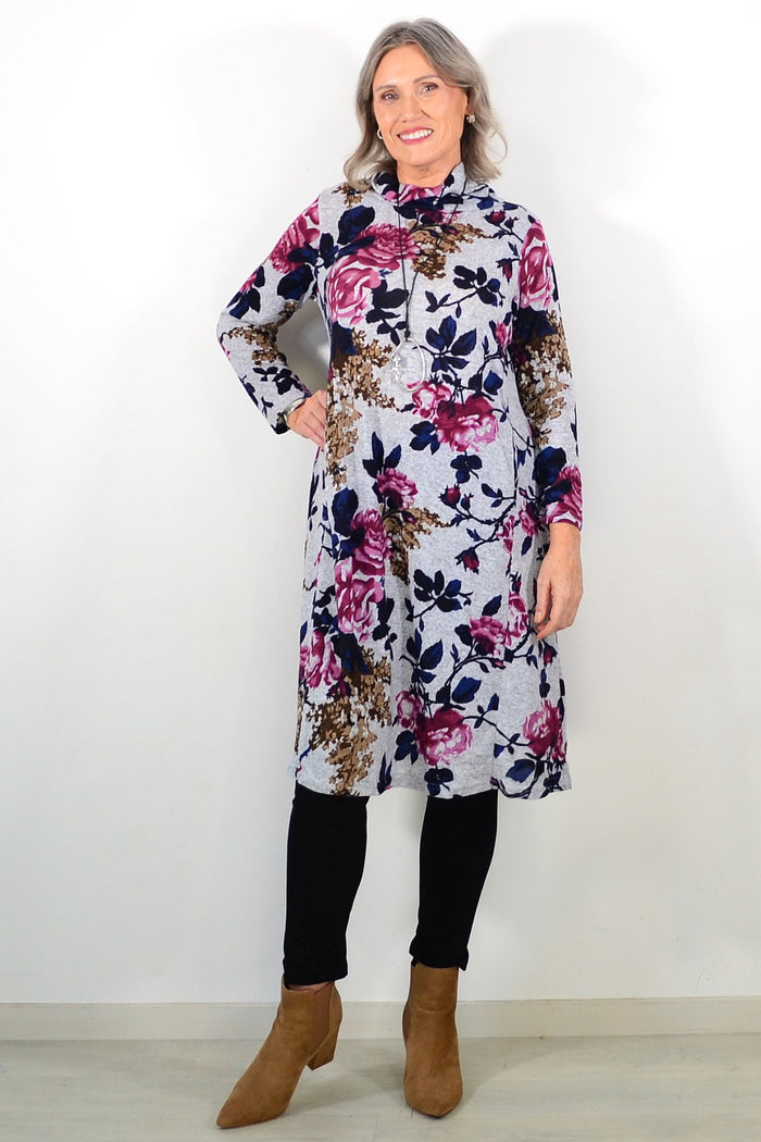 Long pink floral La Mode winter tunic featuring a roll neck and relaxed fit, perfect for cozy cold-weather style.