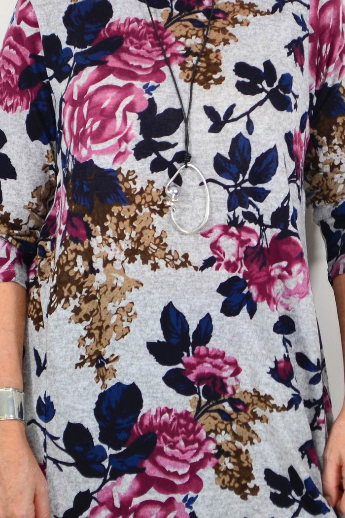 Pink floral long sleeve winter tunic by La Mode with a roll neck and relaxed fit, perfect for cold weather.