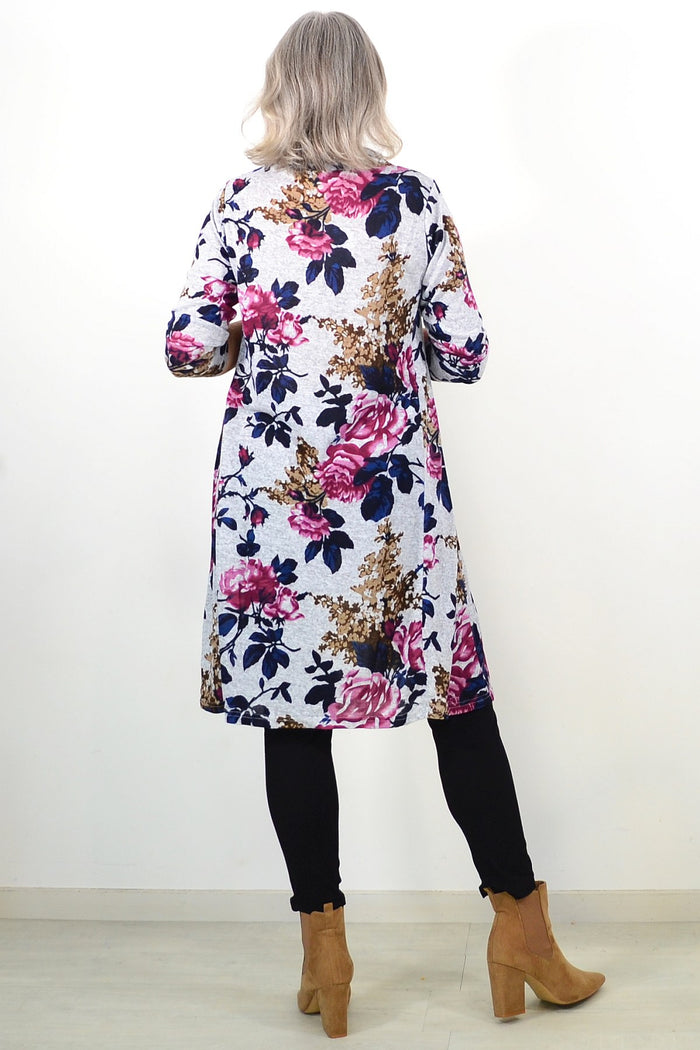 Pink floral long sleeve winter tunic with roll neck from La Mode, shown in a stylish, cozy design suitable for cold weather.