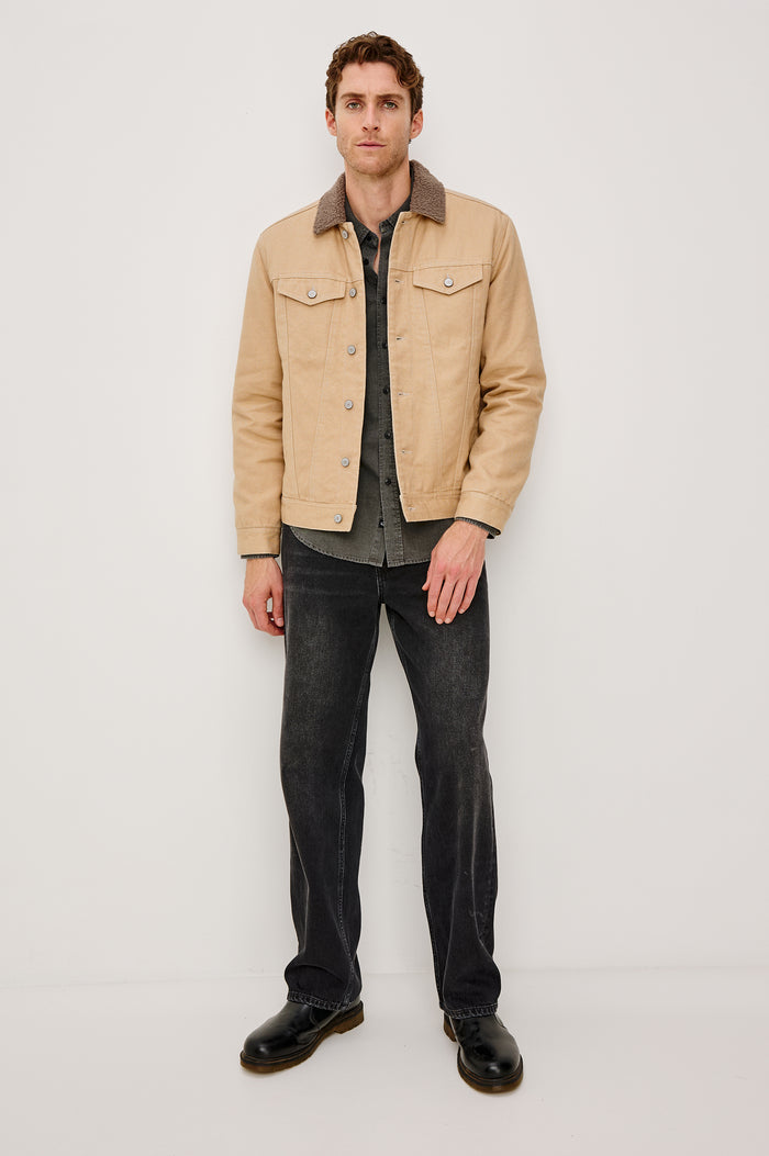 McKinley Jacket with Button Closure, Two Chest Button Flap Pockets and a Brown Contrast Collar in Duck Colorway. Front Full Body View Featured on Model.