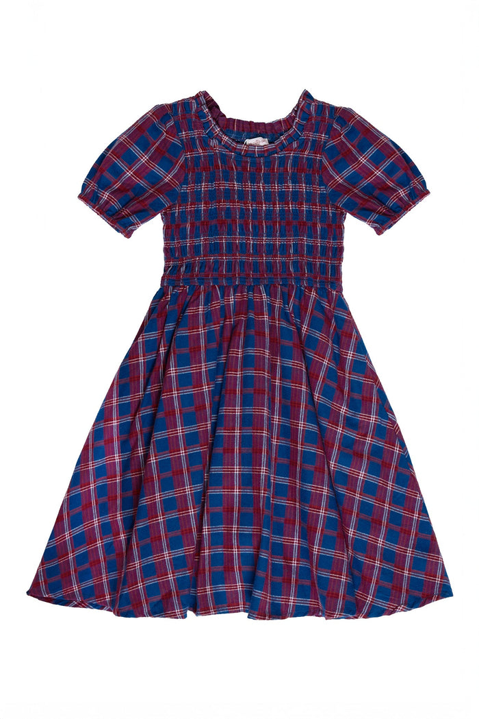 The Mini Mariah Dress in Mariner Tartan by Ivy City Co features short sleeves, a blue and red Mariner Tartan plaid pattern, elastic smocking at the bodice, and a flared skirt. Displayed on a white background, this classic piece is perfect for coordinated mommy and me moments.
