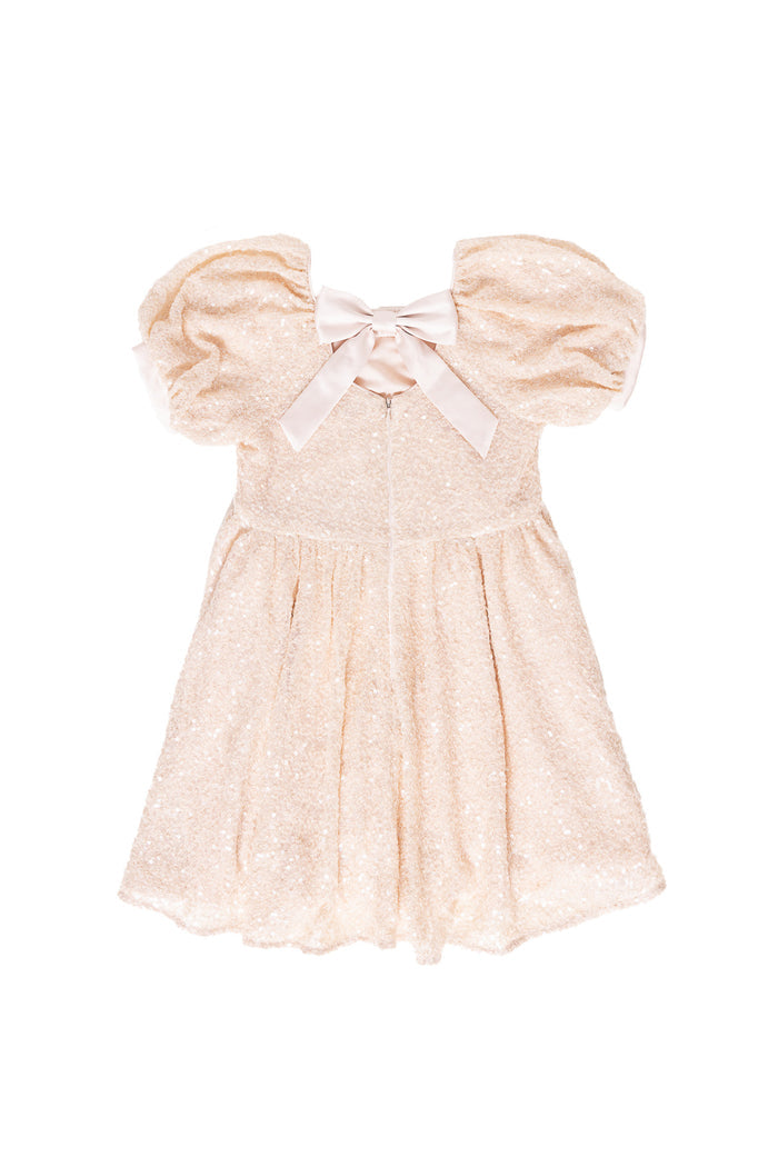 cream sequin dress against a white background