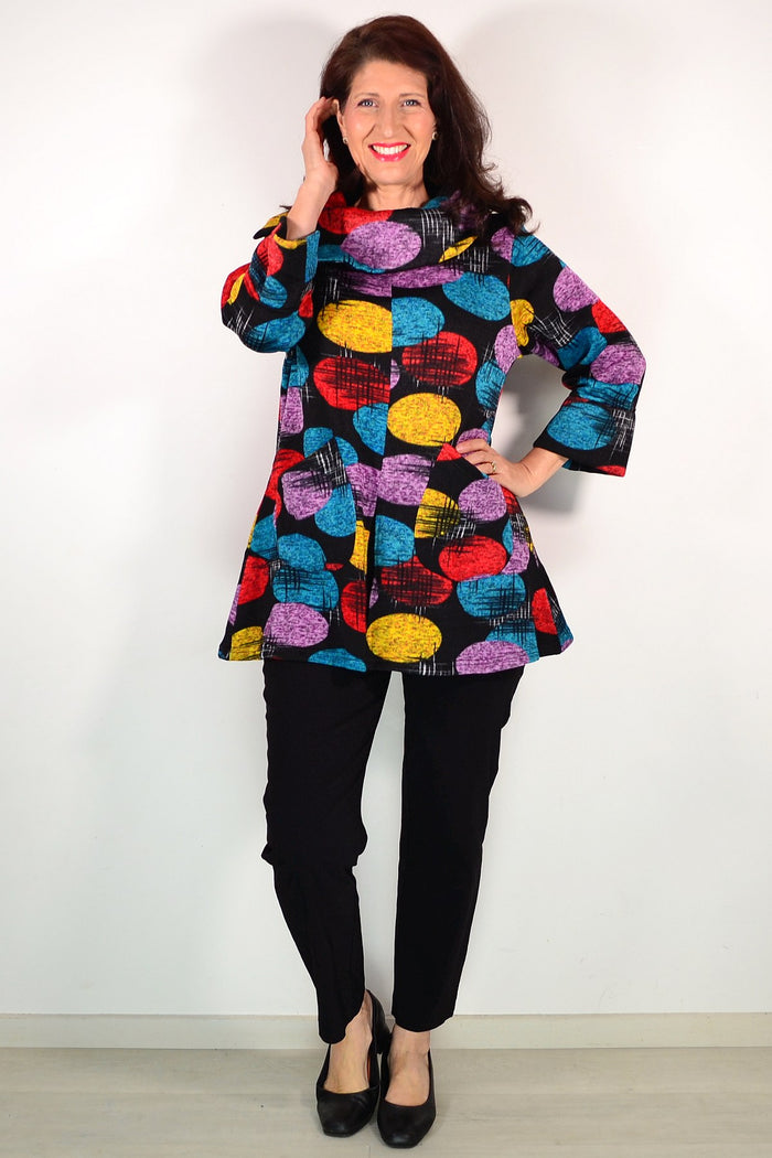 Wishstone multicoloured spots winter tunic top with long sleeves and round neckline, shown on a hanger.