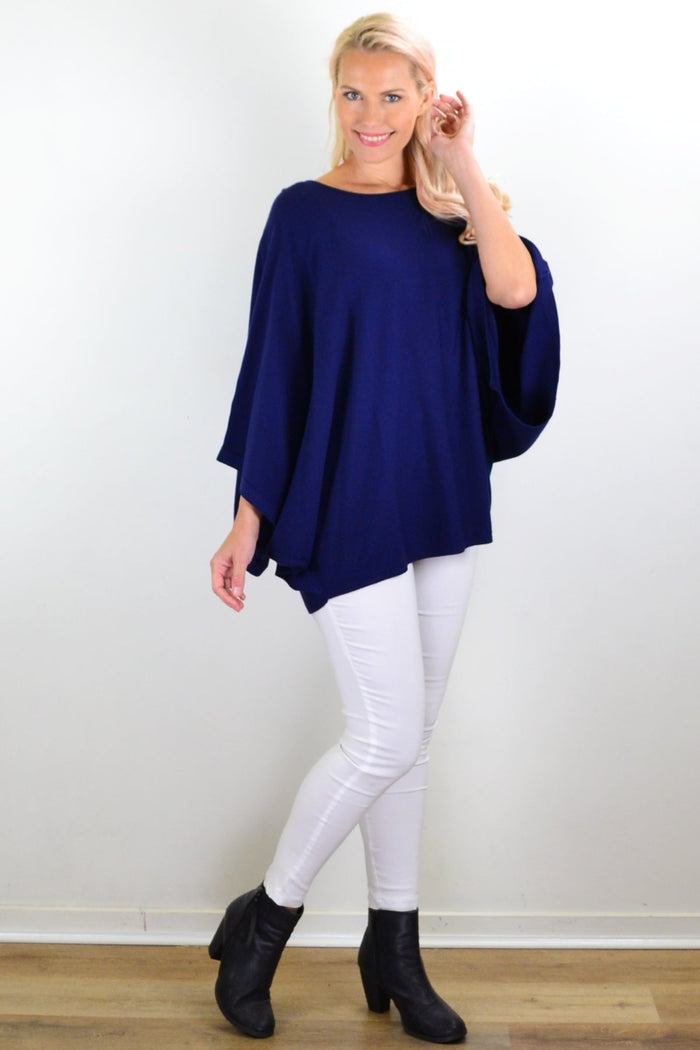 Navy blue rounded tunic poncho by Cali&Co, showing soft fabric and relaxed fit with a rounded neckline and draped style.