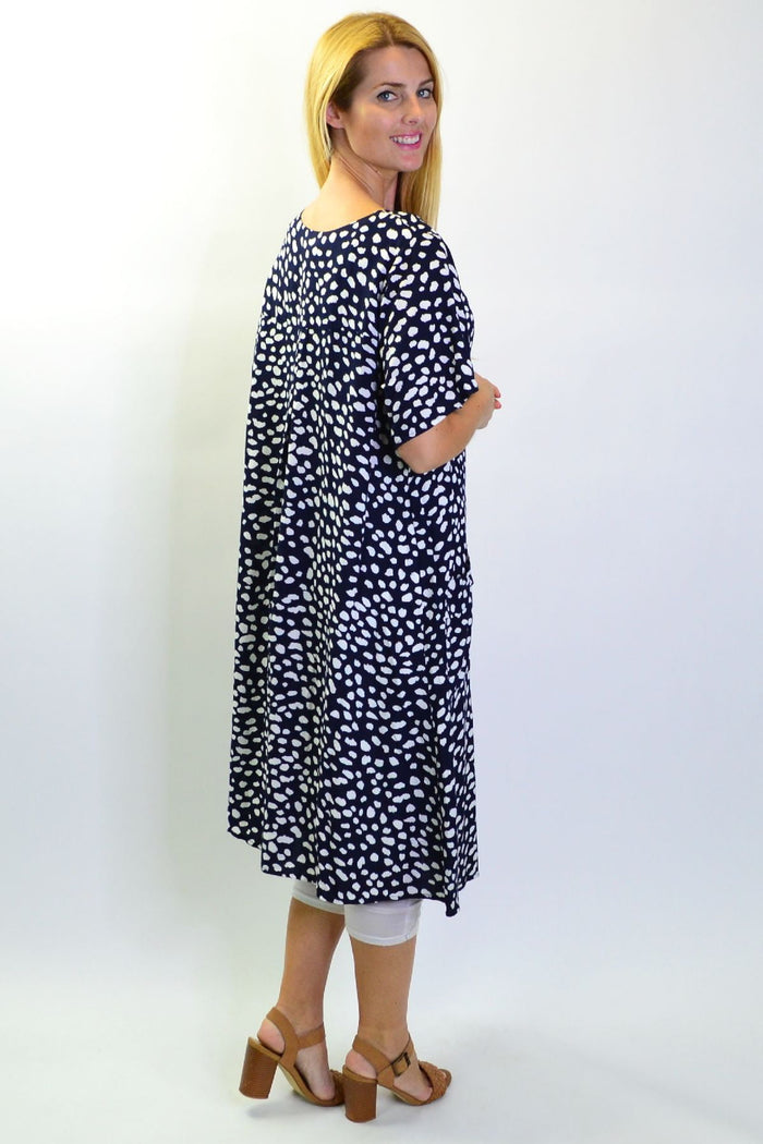 Navy dots and pockets tunic slip dress by Sunshine, featuring a relaxed fit with side pockets and a stylish dotted pattern.