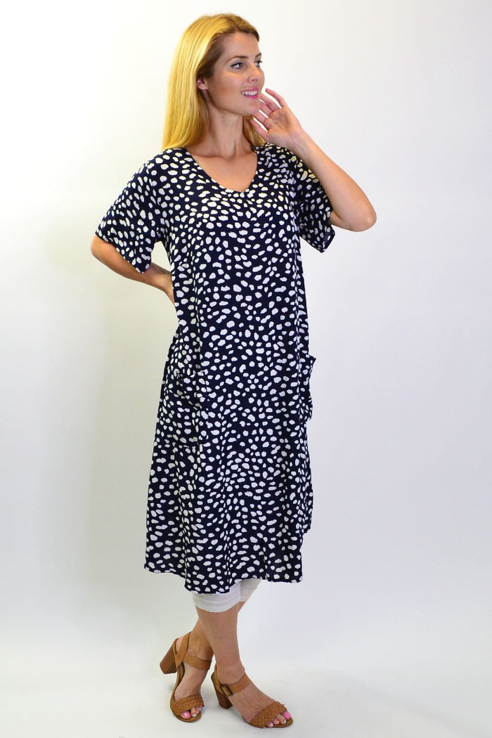 Navy dots and pockets tunic slip dress by Sunshine, featuring a relaxed fit with side pockets and a stylish dotted pattern.