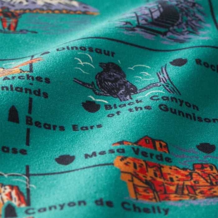 Green Nomadix fitness towel featuring a detailed, colorful map print of national parks and landmarks.