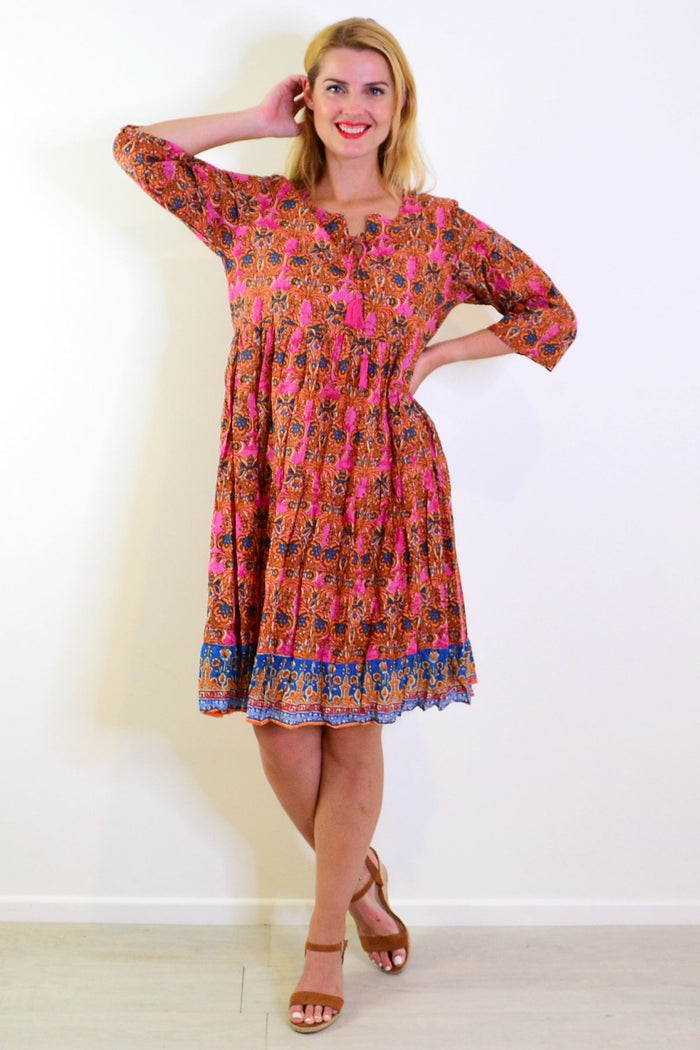 Orange and pink Rebecca tie-neck tunic dress by One Summer, featuring a flowy fabric and stylish design.