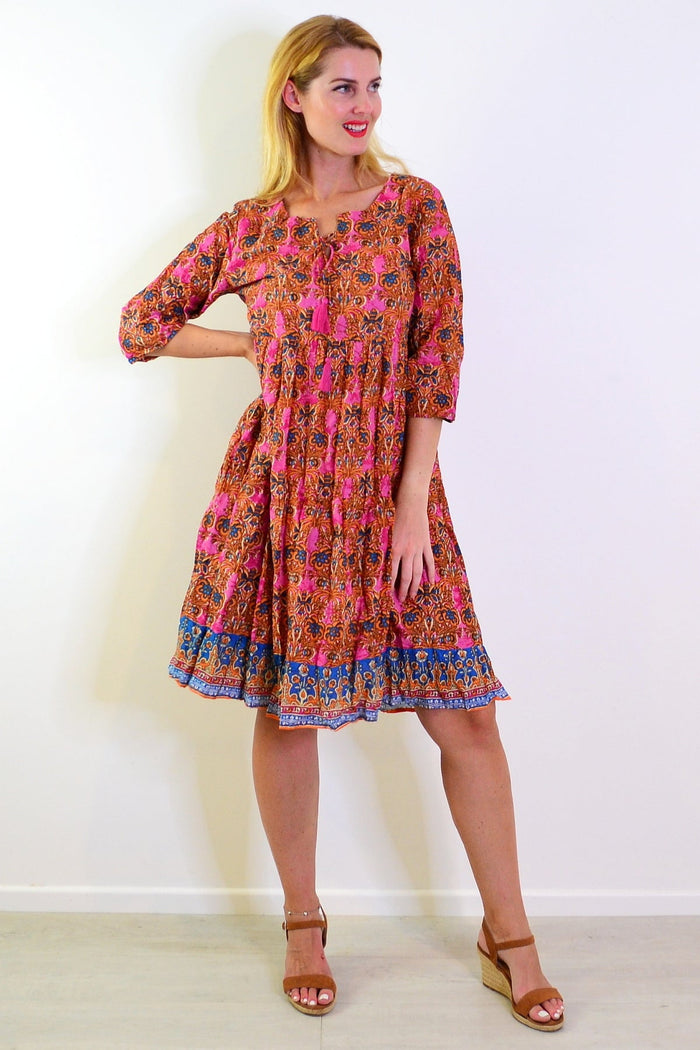 Orange and pink Rebecca tie-neck tunic dress by One Summer, featuring a relaxed fit and stylish neckline in the image.