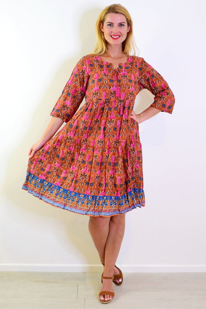 Orange and pink Rebecca tie-neck tunic dress by One Summer, featuring a flowy silhouette and vibrant print.