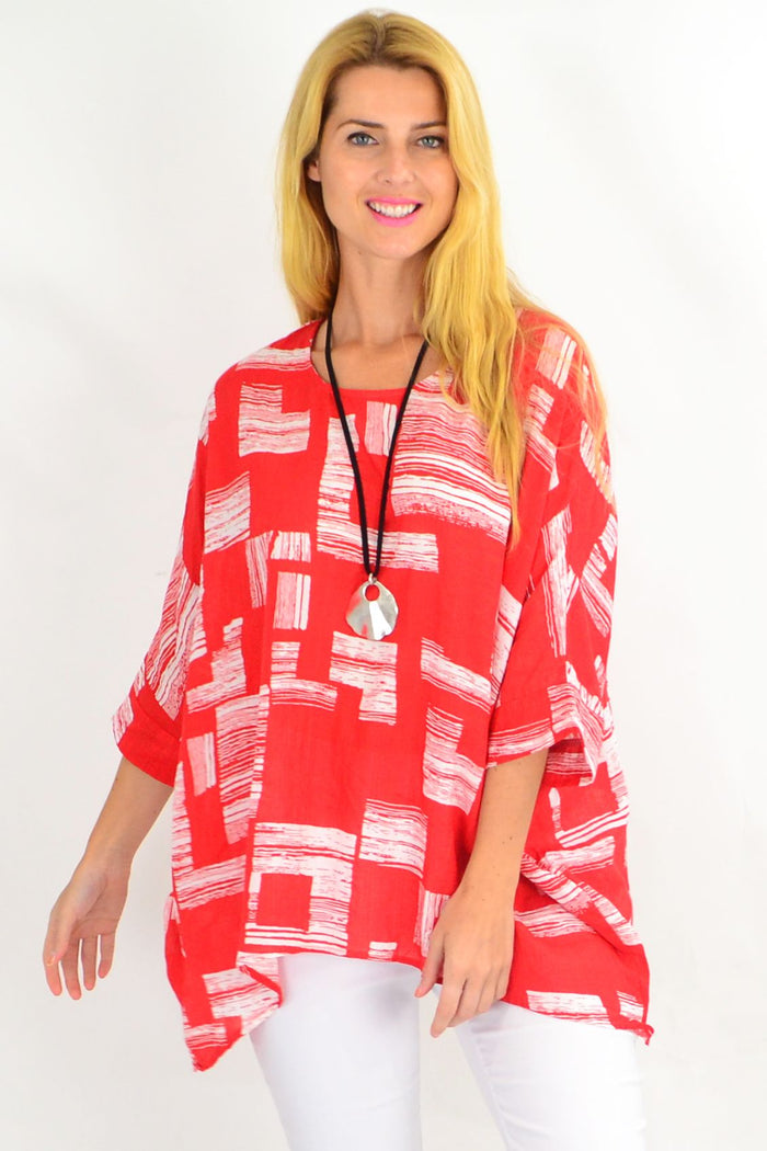 Orange-red and white block tunic top from Missy Q featuring a relaxed fit and stylish design, shown on a model.