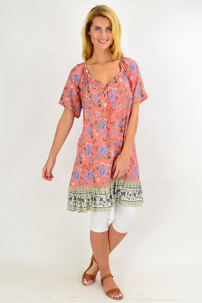 Pink Paisley flowy tunic dress from New U Collection displayed on a hanger, featuring a relaxed fit and bohemian paisley pattern.
