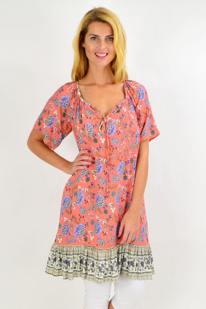 Pink paisley flowy tunic dress from New U Collection, shown hanging with floral details and soft fabric.