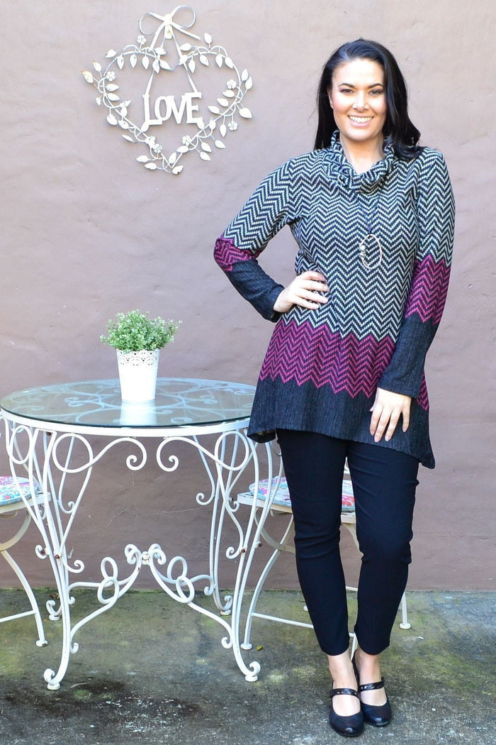Pink zig zag print winter tunic from Whispers, featuring a roll neck and comfortable, stylish design.