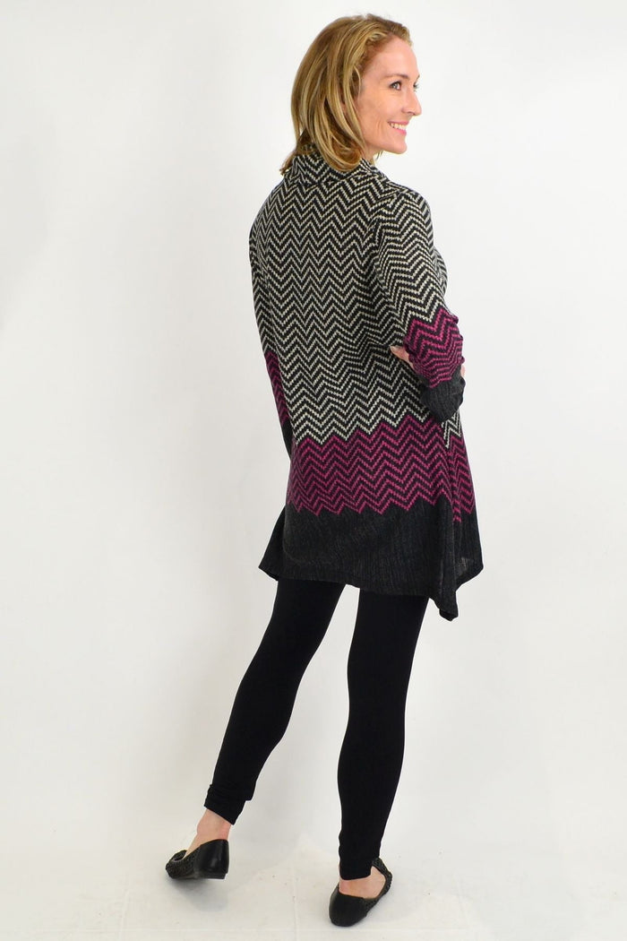 Black zig zag knit tunic from Whispers featuring a cozy roll neck, perfect for winter wear.