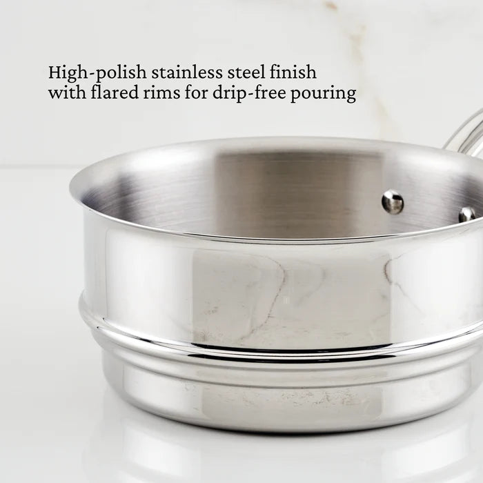 Stainless steel steamer with flared rims on a white background