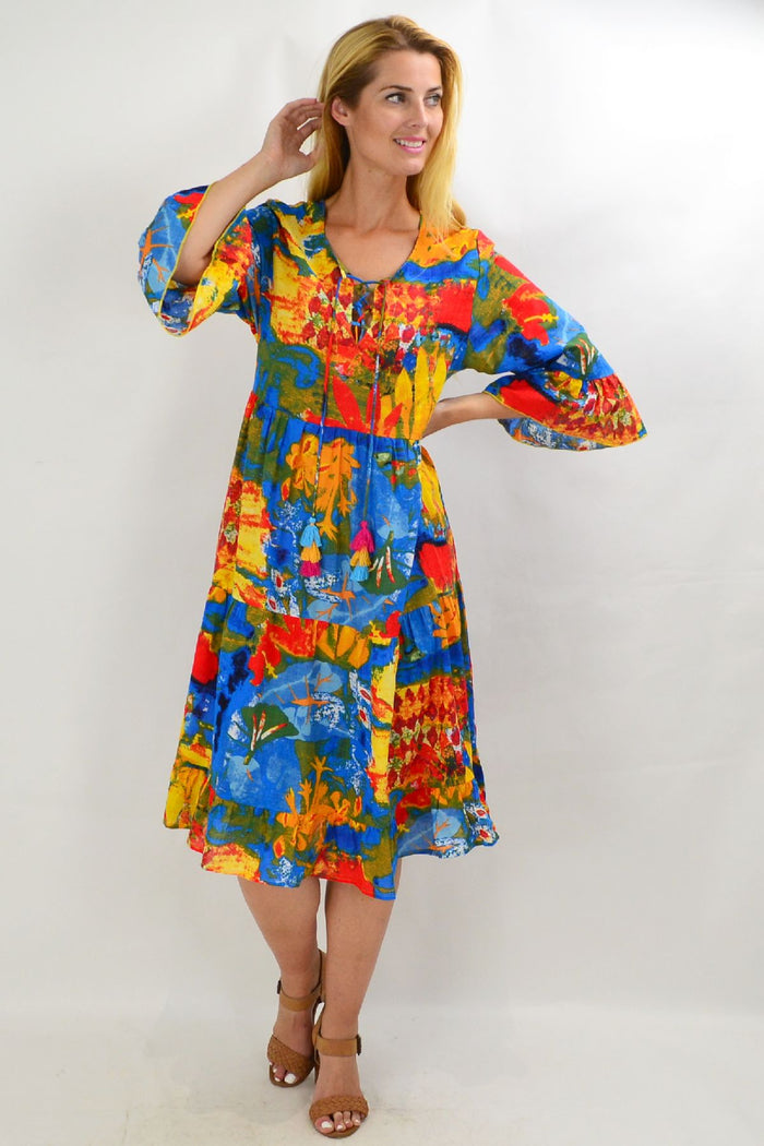 Colorful Rainbow Lily Tiered Tunic Dress by Wishstone, featuring vibrant fabric, flowing tiers, and a relaxed fit for casual wear.