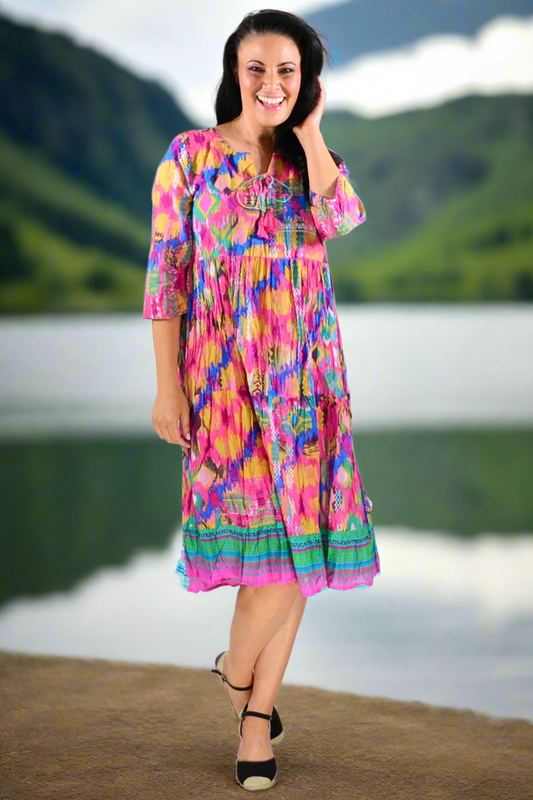 Rebecca Holi Tie Neck Tunic Dress by One Summer, featuring a flowy silhouette with a tie neck detail and vibrant fabric.