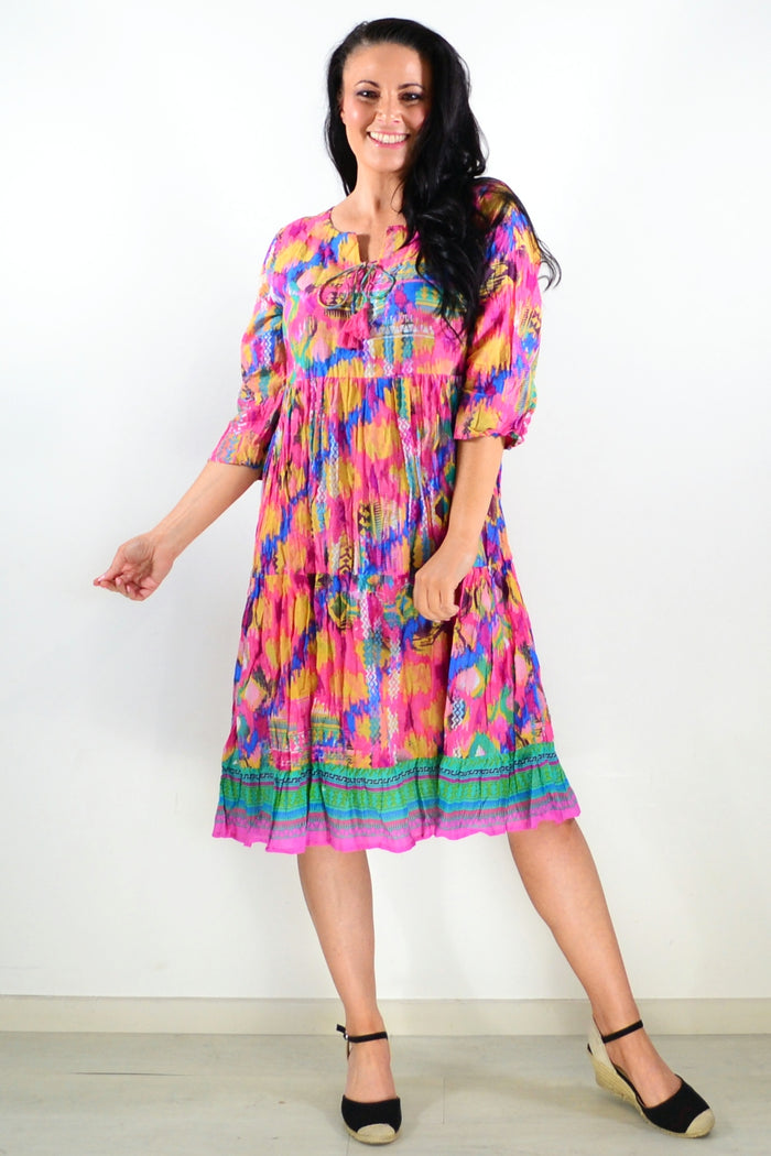 Rebecca Holi tie neck tunic dress by One Summer, featuring a vibrant, flowy design with a tie neckline and lightweight fabric.