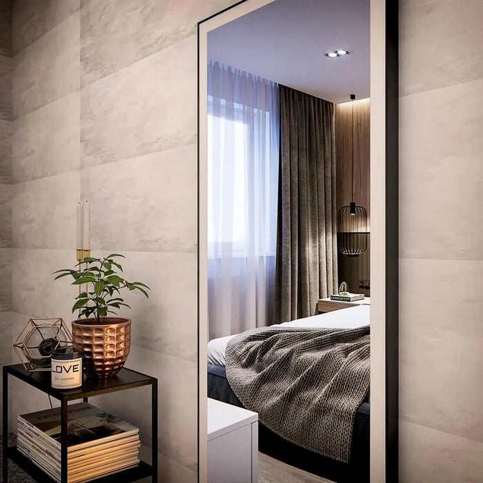 Standing rectangular wall mirror in bedroom