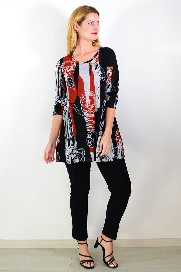Red and grey floral print fleece tunic top by Hourglass, featuring a cozy, casual design with a relaxed fit and vibrant floral pattern.