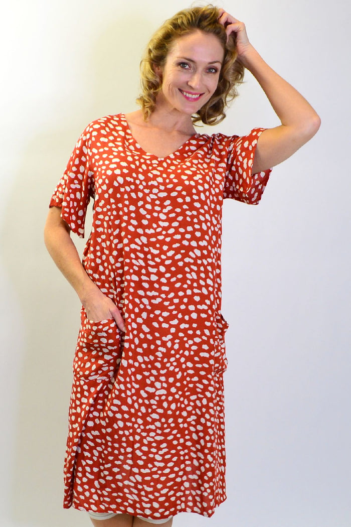Brown and white spotted tunic slip dress with pockets from Sunshine, featuring a rust dot pattern and a relaxed, stylish fit.