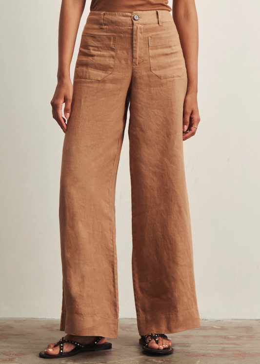 Woman wearing brown wide leg pants with a brown tank top