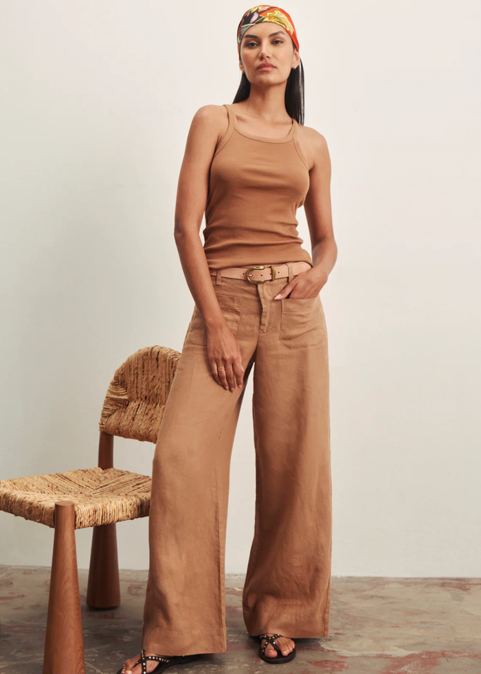 Woman wearing brown wide leg pants with a brown tank top