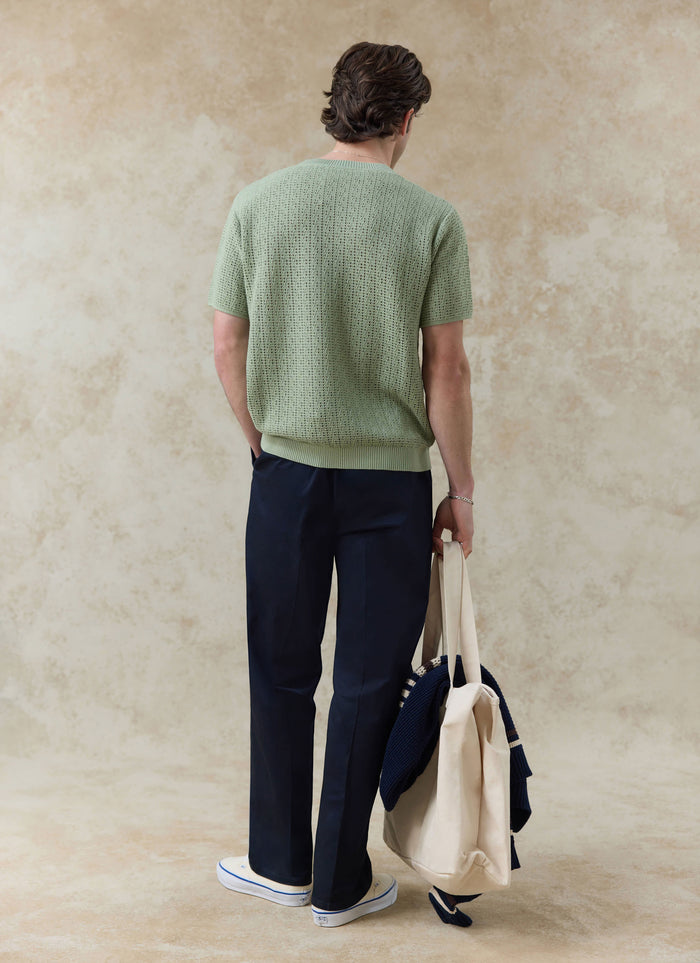 Pistachio Percival Siena Knitted T Shirt in a breathable cotton pointelle knit, shown from behind on a model.