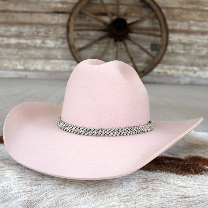 Pink cowboy hat with jeweled band.