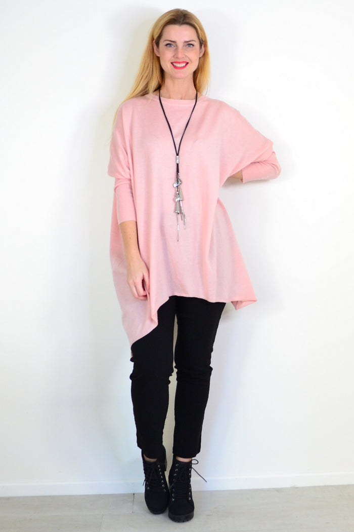 Soft baby pink Boho Australia tunic top with long sleeves and a relaxed fit, displayed on a hanger.