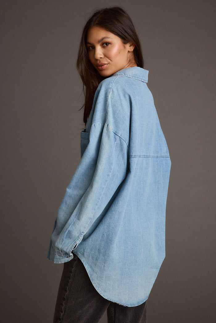 Close-up of the Springsteen Chambray Oversized Button Down Shirt showcasing the fabric texture and design details.
