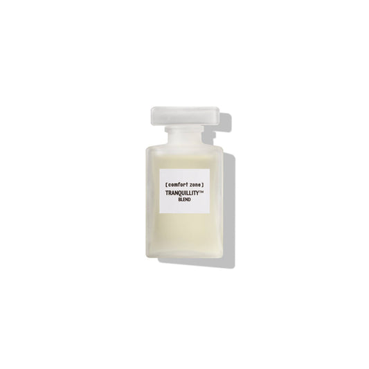 Minimalist frosted glass bottle of Tranquillity™ Blend | [ comfort zone ], a calming skincare oil, photographed on a white background with soft shadow.