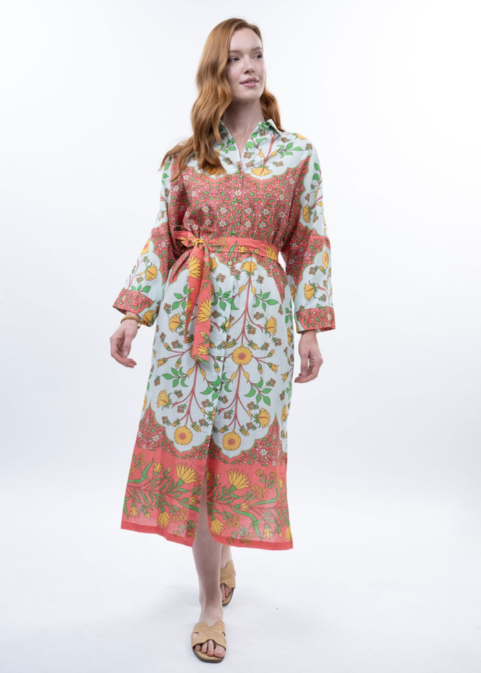Woman wearing a multicolor floral midi dress with sandals