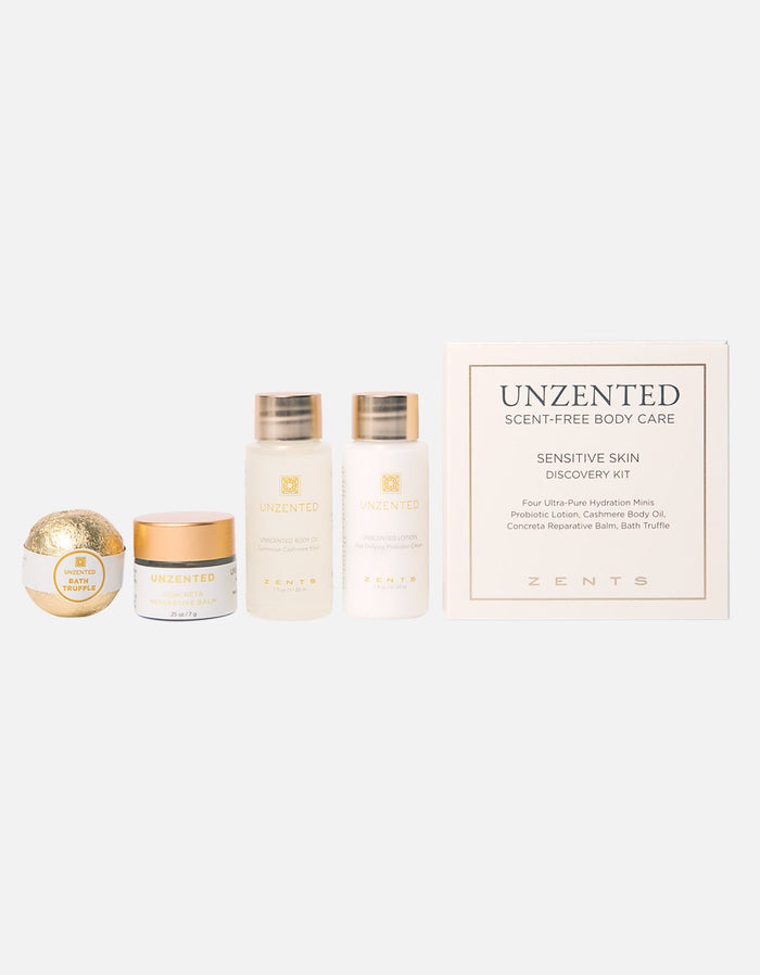 Unzented Sensitive Skin Discovery Kit | Zents featuring four skincare and body care products in white and gold packaging including lotion, body oil, balm, and bath truffle for gentle skincare.