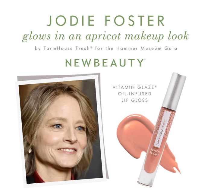 Jodie Foster with an apricot makeup look featuring Farmhouse Fresh Vitamin Glaze® Oil Infused Lip Gloss – Peach Peony displayed with a swatch.