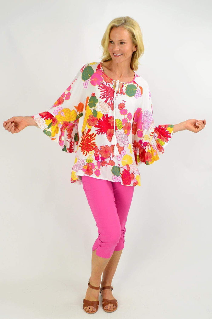 Wide sleeve multicolour floral tunic top from New U Collection, featuring vibrant floral patterns and a relaxed fit.