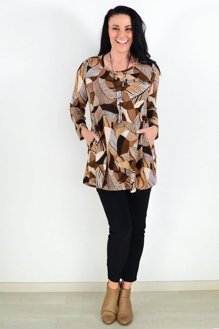 Brown fleece tunic top with winter leaves pattern from Hourglass, featuring a cozy, relaxed fit and autumn-inspired design.