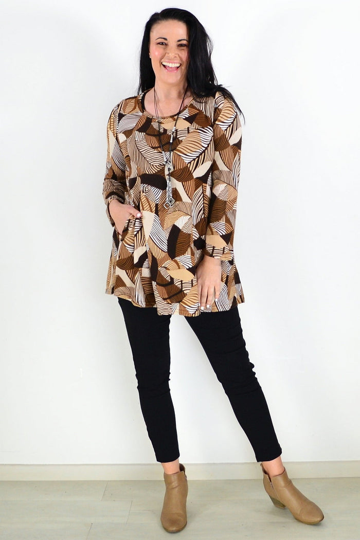 Brown fleece tunic top with winter leaf pattern from Hourglass, showcasing a cozy, relaxed fit and detailed leaf design.
