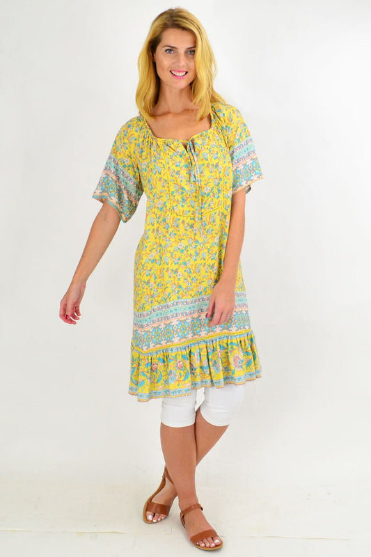 Yellow floral flowy tunic top from New U Collection featuring lightweight fabric and a relaxed fit, perfect for casual wear.